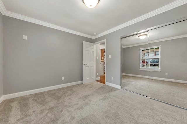 1354 Nutmeg Dr, Saint Charles, MO 63303 - unfurnished bedroom with a closet, crown molding, carpet flooring, and baseboards
