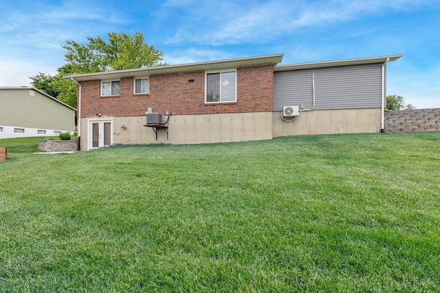 1354 Nutmeg Dr, Saint Charles, MO 63303 - back of house featuring a lawn, french doors, and brick siding
