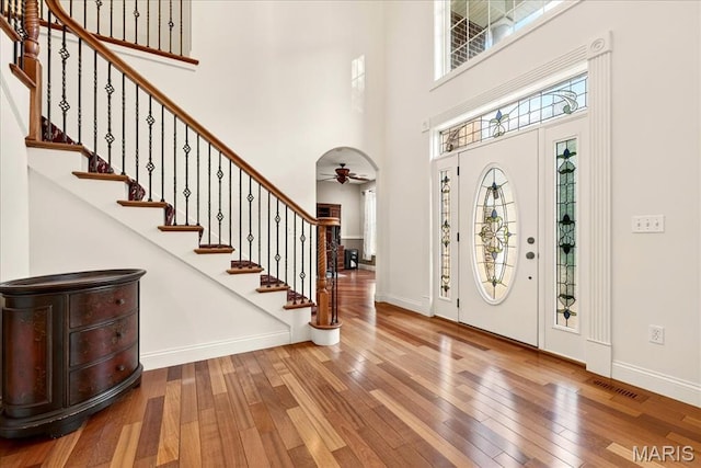 125 Park Lawn Est, Fenton, MO 63026 - entryway with hardwood / wood-style floors, a high ceiling, ceiling fan, and stairs