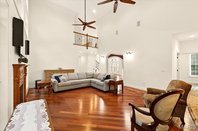 125 Park Lawn Est, Fenton, MO 63026 - living area with a ceiling fan, hardwood / wood-style flooring, high vaulted ceiling, arched walkways, and crown molding