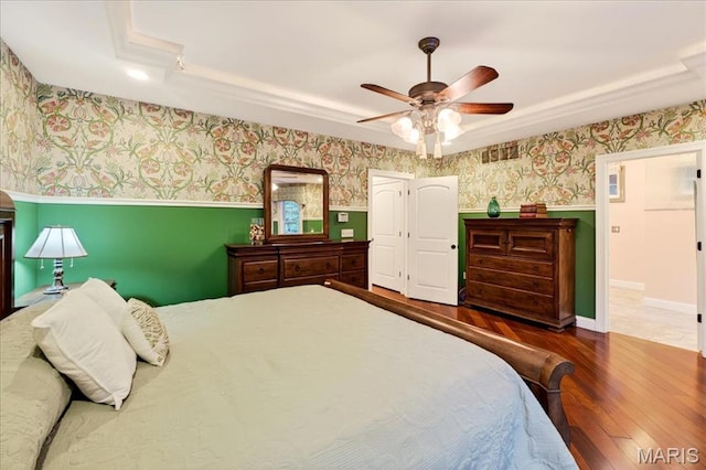 125 Park Lawn Est, Fenton, MO 63026 - bedroom featuring wallpapered walls, a wainscoted wall, wood-type flooring, crown molding, and ceiling fan