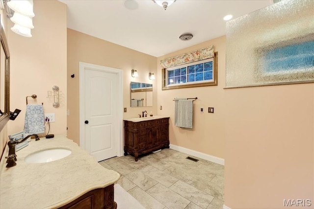 125 Park Lawn Est, Fenton, MO 63026 - full bathroom with two vanities and baseboards