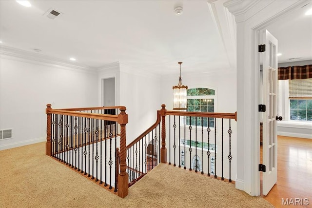 125 Park Lawn Est, Fenton, MO 63026 - hall featuring crown molding, an upstairs landing, a chandelier, carpet floors, and recessed lighting
