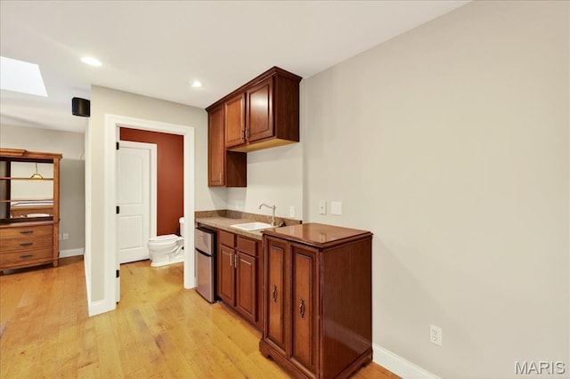 125 Park Lawn Est, Fenton, MO 63026 - kitchen with light wood-style floors, recessed lighting, and freestanding refrigerator