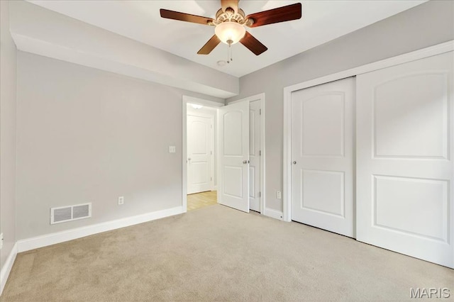 125 Park Lawn Est, Fenton, MO 63026 - unfurnished bedroom featuring light colored carpet, a closet, and ceiling fan