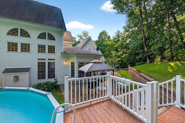 125 Park Lawn Est, Fenton, MO 63026 - wooden deck featuring a gazebo, a lawn, and an outdoor pool