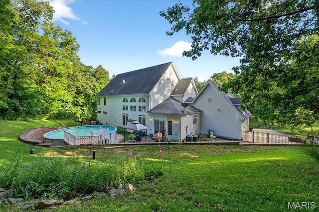 125 Park Lawn Est, Fenton, MO 63026 - rear view of property with an outdoor pool and a patio area