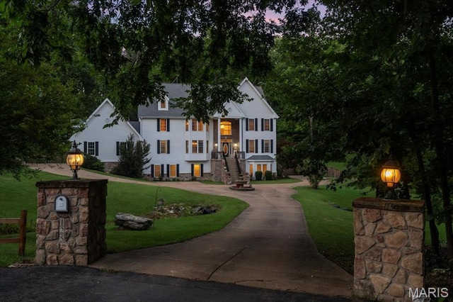 125 Park Lawn Est, Fenton, MO 63026 - view of front of property featuring stairway, curved driveway, and a lawn