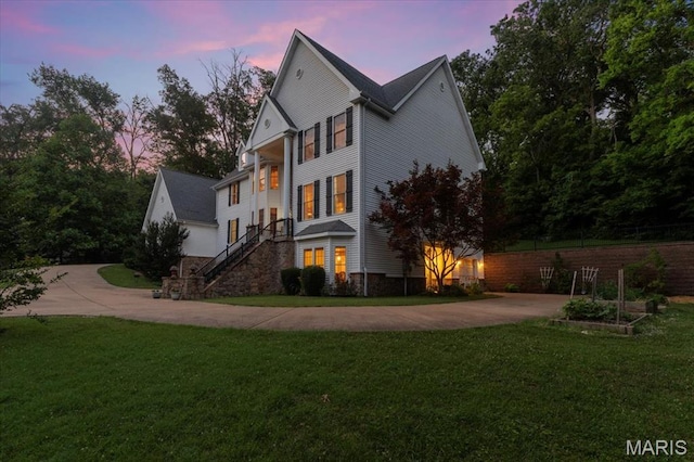 125 Park Lawn Est, Fenton, MO 63026 - view of front of home featuring concrete driveway, a lawn, and stairway