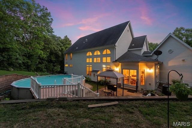 125 Park Lawn Est, Fenton, MO 63026 - back of property featuring a gazebo, a lawn, and an outdoor pool