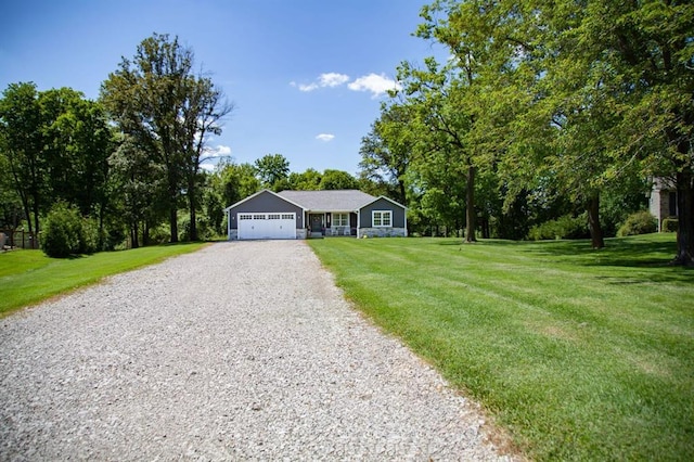 20083 Southview Dr, Carlyle, IL 62231 - ranch-style house with driveway, an attached garage, and a front lawn