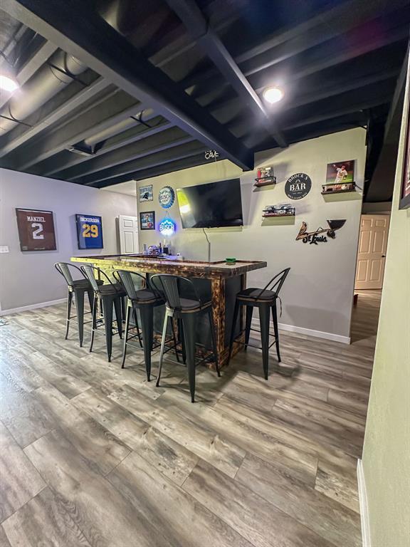 20083 Southview Dr, Carlyle, IL 62231 - indoor dry bar with wood finished floors and baseboards