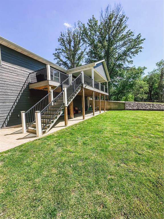 20083 Southview Dr, Carlyle, IL 62231 - rear view of house with stairs, a patio, and a wooden deck