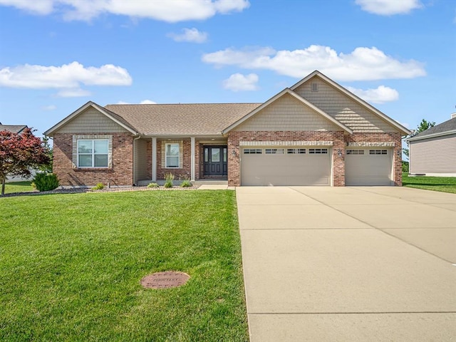 1051 Creekside Dr, Waterloo, IL 62298 - view of front of home with driveway, a garage, brick siding, and a front yard