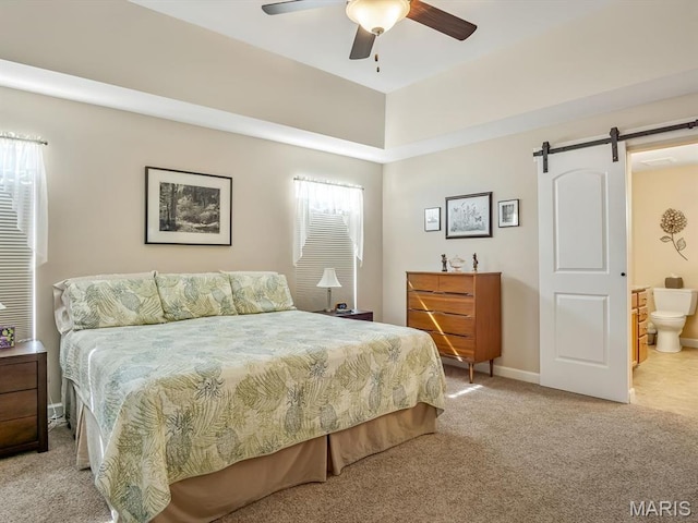 1051 Creekside Dr, Waterloo, IL 62298 - carpeted bedroom with a barn door and a ceiling fan