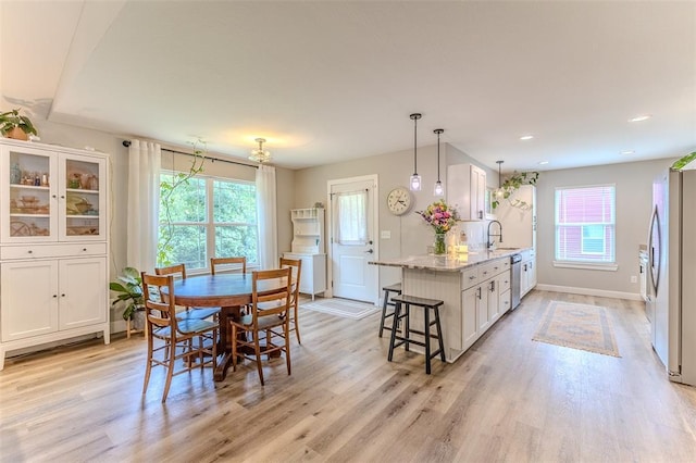 153 Mesa Dr, Waynesville, MO 65583 - dining space with healthy amount of natural light, light wood-style floors, baseboards, and recessed lighting