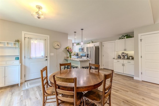 153 Mesa Dr, Waynesville, MO 65583 - dining space with light wood finished floors