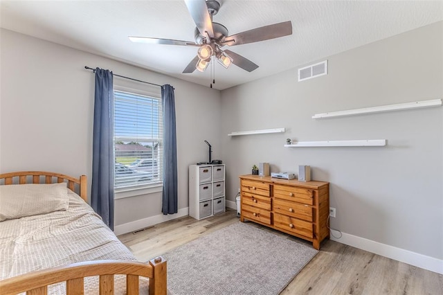 153 Mesa Dr, Waynesville, MO 65583 - bedroom featuring baseboards, wood finished floors, and a ceiling fan