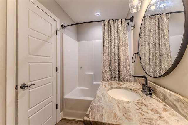 153 Mesa Dr, Waynesville, MO 65583 - full bathroom featuring shower / tub combo, vanity, and wood finished floors