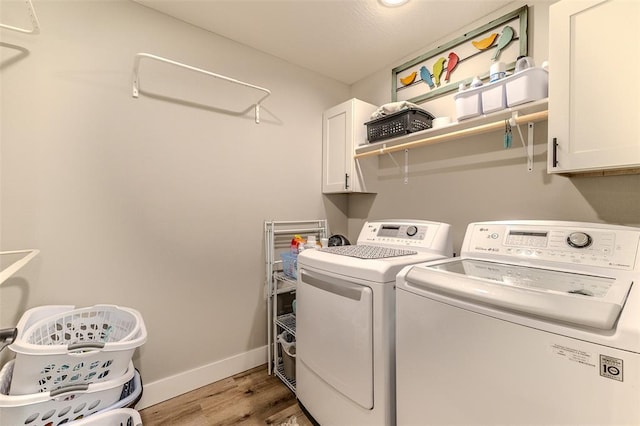 153 Mesa Dr, Waynesville, MO 65583 - laundry room with cabinet space, independent washer and dryer, light wood finished floors, and baseboards