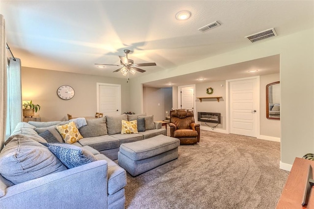 153 Mesa Dr, Waynesville, MO 65583 - carpeted living area with ceiling fan, baseboards, a glass covered fireplace, and recessed lighting