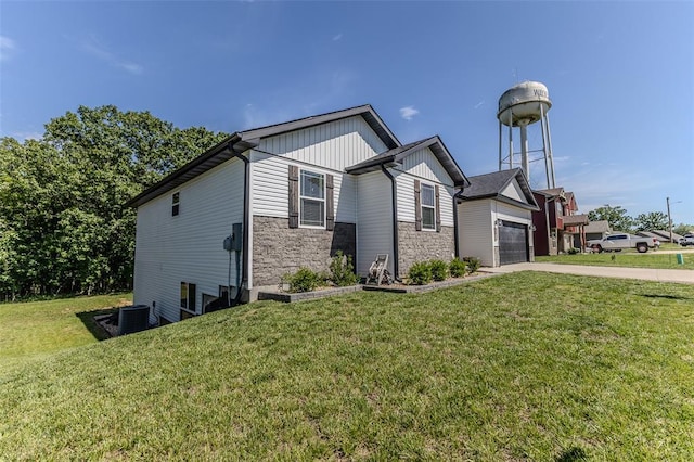 153 Mesa Dr, Waynesville, MO 65583 - view of front of house featuring stone siding, a front lawn, concrete driveway, and board and batten siding