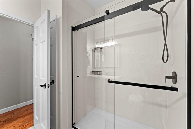 2347 Callaway Fork Rd, Defiance, MO 63341 - full bath with a stall shower, wood finished floors, and baseboards