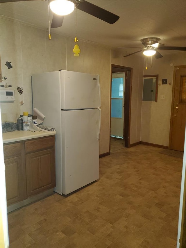 19 Agnes Dr, Cahokia, IL 62206 - kitchen with freestanding refrigerator, a ceiling fan, electric panel, and baseboards