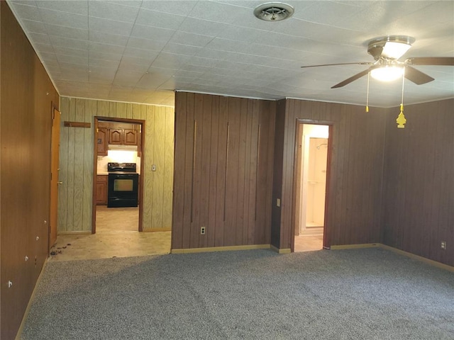 19 Agnes Dr, Cahokia, IL 62206 - unfurnished room featuring ceiling fan, light colored carpet, and wooden walls