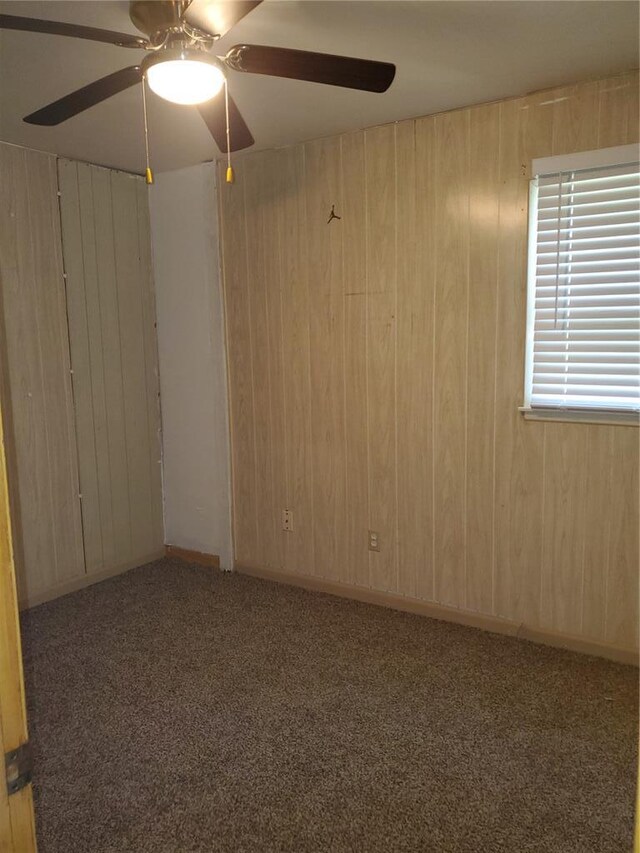 19 Agnes Dr, Cahokia, IL 62206 - carpeted empty room with ceiling fan and wood walls