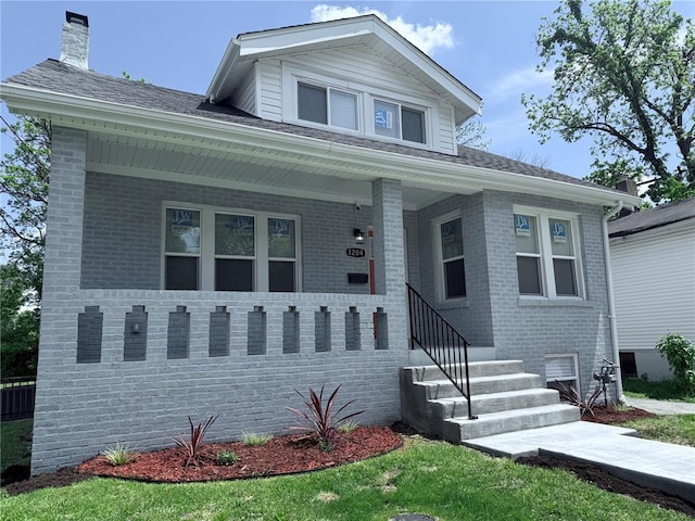 1204 Griefield Pl, Pagedale, MO 63133 - bungalow featuring brick siding and covered porch