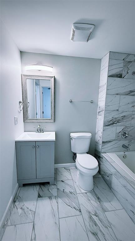 1204 Griefield Pl, Pagedale, MO 63133 - bathroom with baseboards, marble finish flooring, and vanity