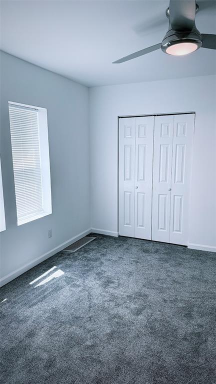 1204 Griefield Pl, Pagedale, MO 63133 - unfurnished bedroom featuring carpet floors and baseboards