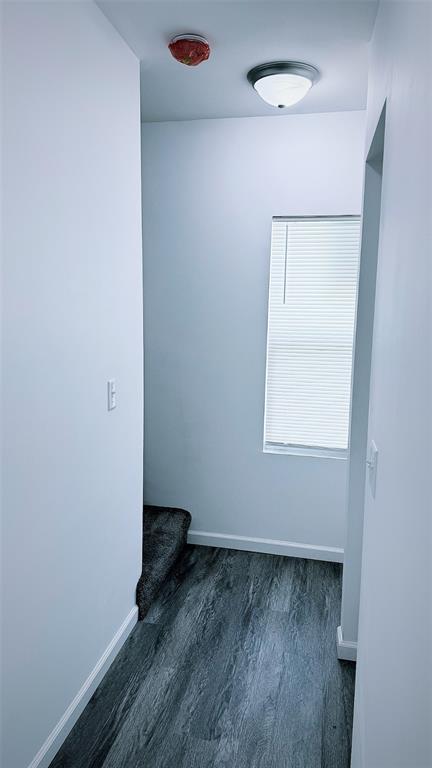 1204 Griefield Pl, Pagedale, MO 63133 - empty room featuring wood finished floors and baseboards