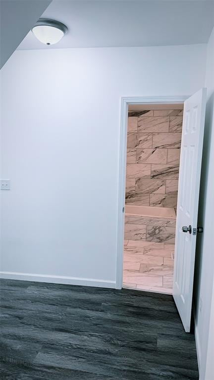1204 Griefield Pl, Pagedale, MO 63133 - empty room with dark wood-style flooring and baseboards