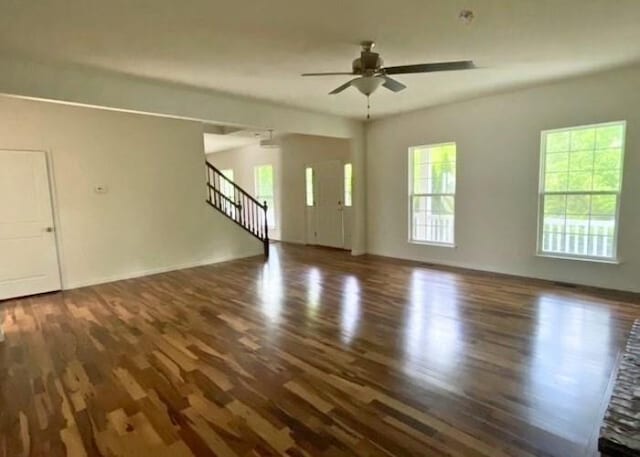 116 Sweet Cherry Way, Grover, MO 63040 - unfurnished living room featuring wood finished floors, a ceiling fan, and stairway