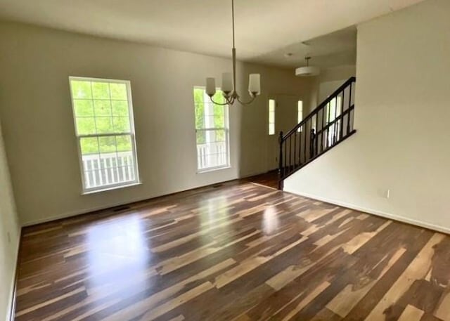 116 Sweet Cherry Way, Grover, MO 63040 - unfurnished room with a chandelier, wood finished floors, stairway, and baseboards