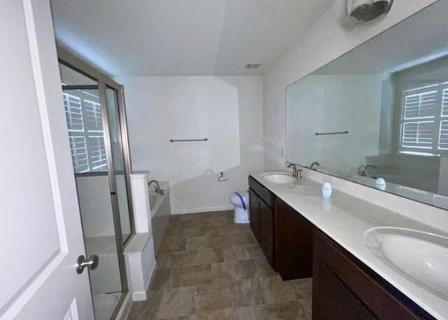116 Sweet Cherry Way, Grover, MO 63040 - bathroom featuring a stall shower, double vanity, and a garden tub