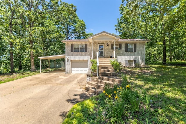 129 Ripley 142e-24c, Doniphan, MO 63935 - view of front of house featuring driveway, brick siding, a garage, an attached carport, and a front yard