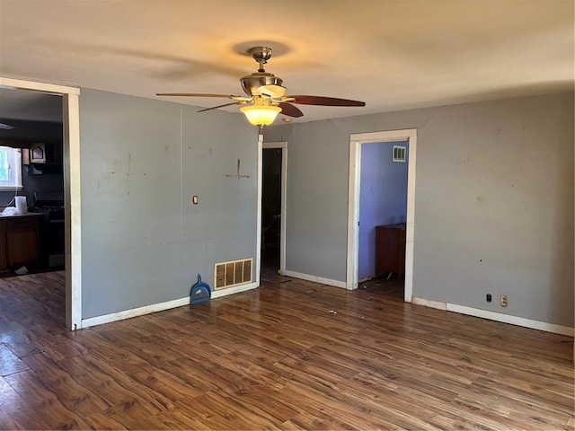 423 Kathryn Dr, Arnold, MO 63010 - unfurnished room with a ceiling fan, wood finished floors, and baseboards