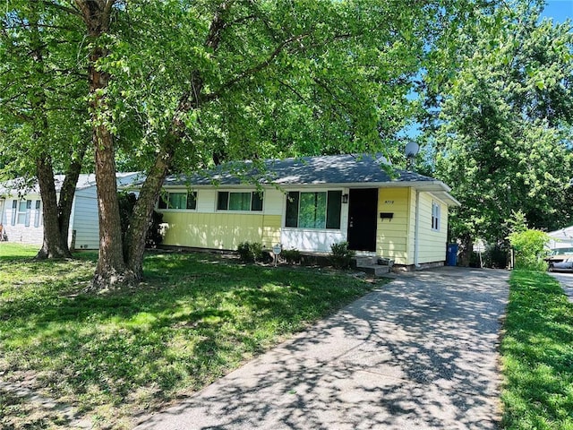 9715 Millburn Dr, Saint Louis, MO 63136 - single story home featuring concrete driveway and a front yard