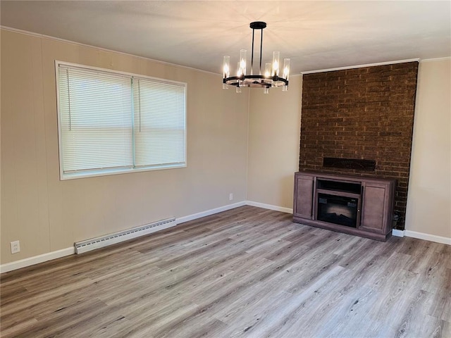 9715 Millburn Dr, Saint Louis, MO 63136 - unfurnished living room featuring a baseboard radiator, a chandelier, wood finished floors, ornamental molding, and a large fireplace