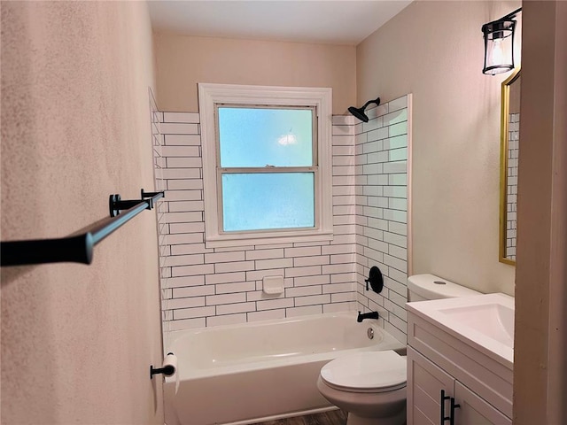 9715 Millburn Dr, Saint Louis, MO 63136 - bathroom featuring toilet, vanity, and shower / bathtub combination