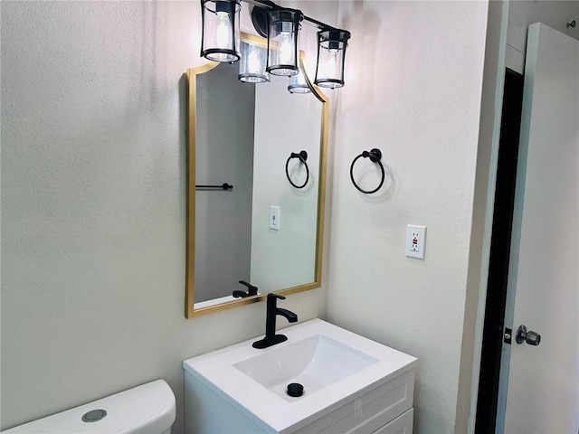 9715 Millburn Dr, Saint Louis, MO 63136 - half bathroom featuring vanity and toilet