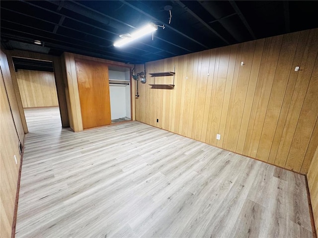 9715 Millburn Dr, Saint Louis, MO 63136 - finished basement featuring light wood-type flooring and wood walls