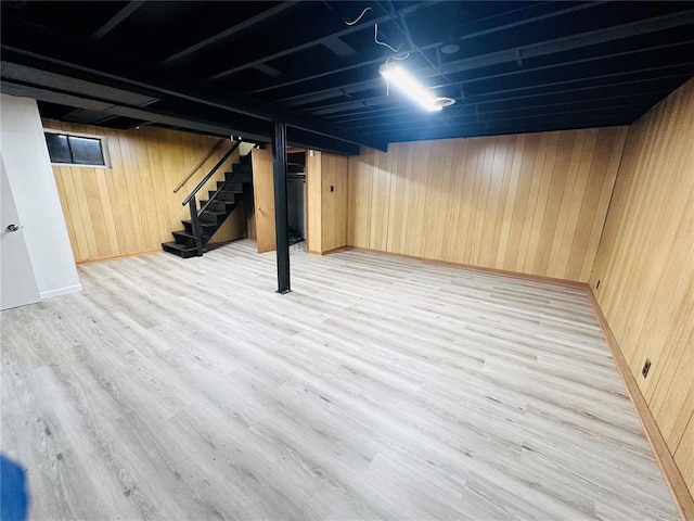 9715 Millburn Dr, Saint Louis, MO 63136 - finished basement with wooden walls, stairs, and light wood-type flooring