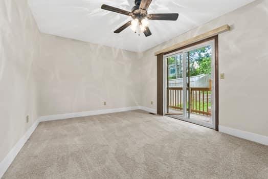 352 Della Dr, Saint Peters, MO 63376 - unfurnished room featuring carpet, baseboards, and ceiling fan