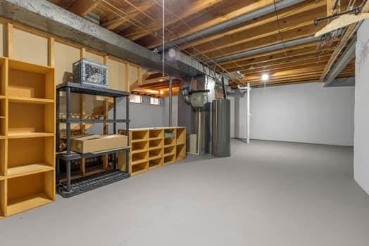 352 Della Dr, Saint Peters, MO 63376 - unfinished basement featuring water heater