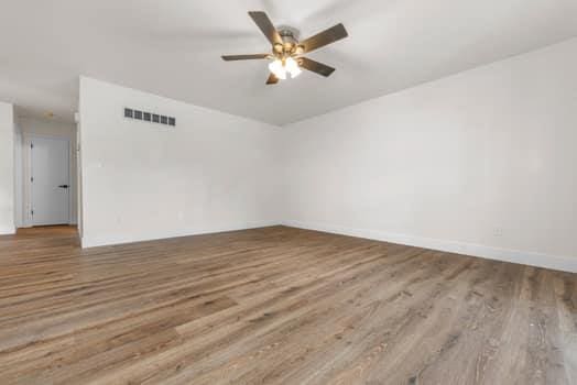 352 Della Dr, Saint Peters, MO 63376 - empty room featuring wood finished floors, ceiling fan, and baseboards