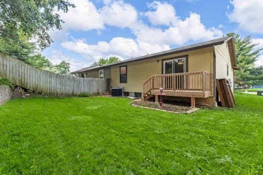 352 Della Dr, Saint Peters, MO 63376 - rear view of house with a deck and central AC